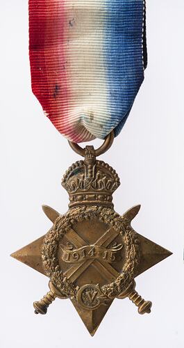 Star-shaped medal with red white and blue striped ribbon.