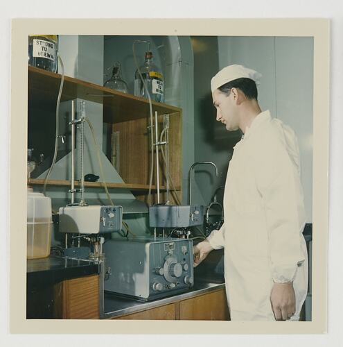 Slide 140, Worker Checking Solution, Kodak Factory, Coburg, 'Extra Prints of Coburg Lecture' album, circa 1960s