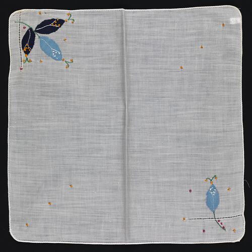 Unfolded handkerchief with blue Applique Flowers.