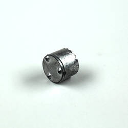 Underside, toy silver pot.