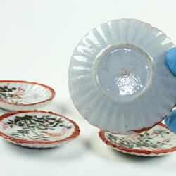 Underside view of Japanese style toy tea set saucer.
