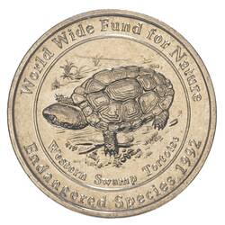 Round medal with wide rim framing a Western Swamp Tortoise advancing left, head front. Text around.