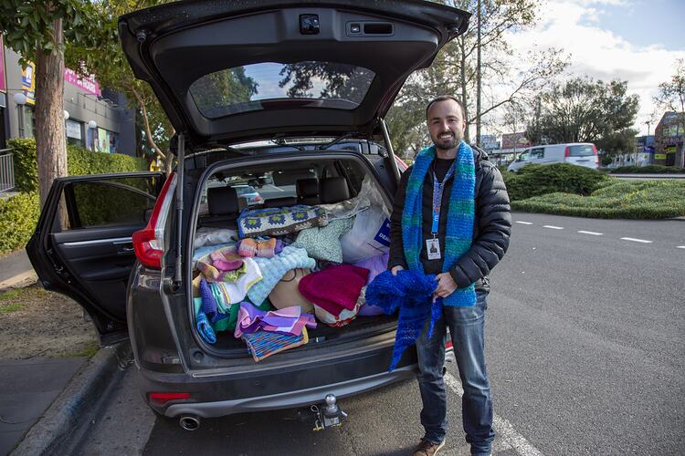 Wellways Australia Staff Member Packing Knitted Garments for Charity into Car during COVID-19, Victoria, 15 July 2020