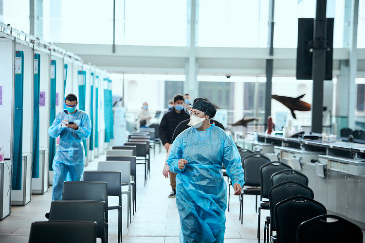Staff Member Walking Through Foyer, St Vincent's Vaccination Hub, Melbourne Museum, 23 Sep 2021