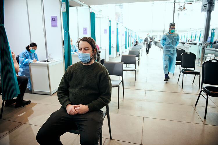 Andrew waiting for vaccination, St Vincent's Vaccination Hub, Melbourne Museum, 23 Sep 2021