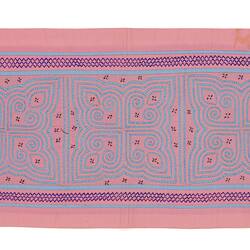 Pink and blue rectangular runner. Five identical maze-like designs along the centre.