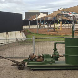 Side view of pump mounted on trolley frame.