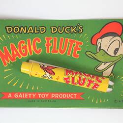 Green box with yellow flute and donald duck.