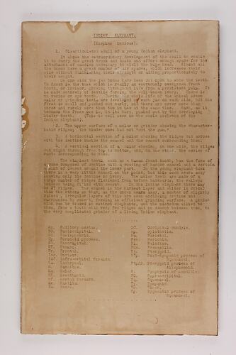 Brown rectangular label with extensive black text.