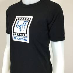 Black t-shirt with white square logo and blue text on front, on mannequin, three quarter view.