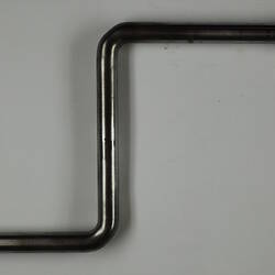 Bent metal hand crank.