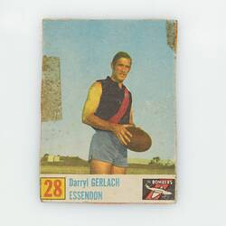 Football card, number 28, with player holding football.