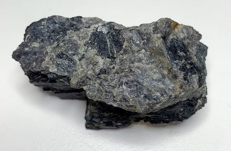 Blackish-blue rock formation.