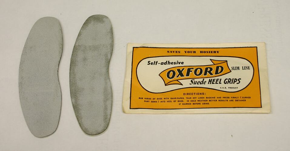 Heel grips beside package.