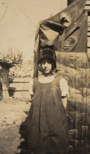 Digital Photograph - Girl Standing near Backyard Sheds, South Melbourne, circa 1935