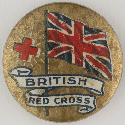 Round  badge with British flag and red cross.