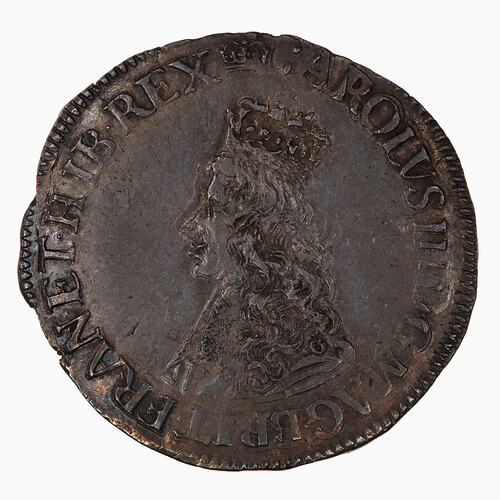 Coin, round, Crowned and draped bust of a king, facing left; text around.