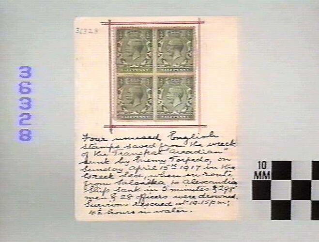 Front of page with four stamps and hand-writing.