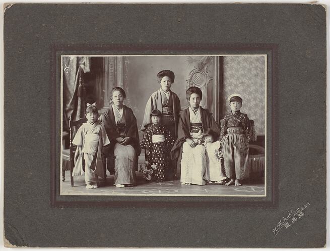 Three women and three children wearing traditional Japanese dress.