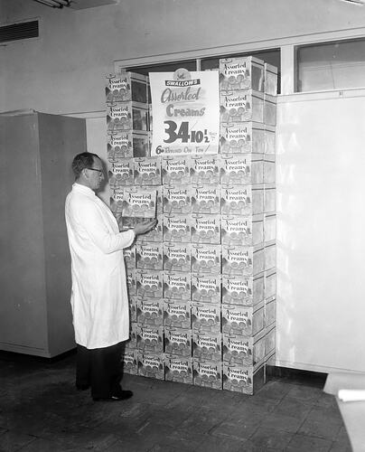 Swallow & Ariell Ltd, Employee with Biscuit Display, Port Melbourne, Victoria, Sep 1957