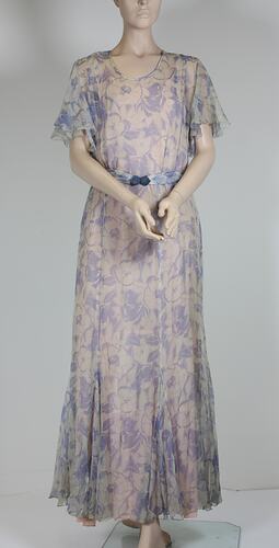 Long blue, white printed floral dress, short sleeves.