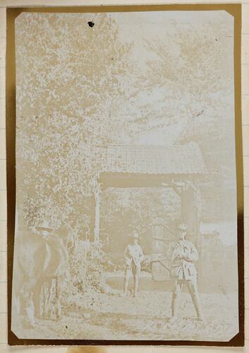 Soldiers standing near front gates.