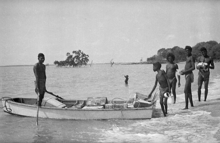 Unidentified men in a boat, Milingimbi, Northern Territory,  late 1920s-30s