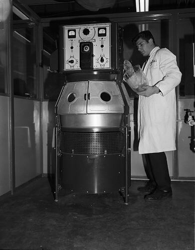 Monochrome photograph of a hoisery factory.