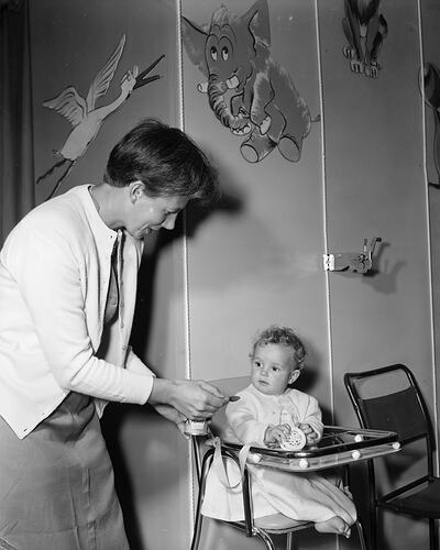 H.J. Heinz Co, Woman Feeding a Baby at an Exhibition, Melbourne, 23 Feb 1960