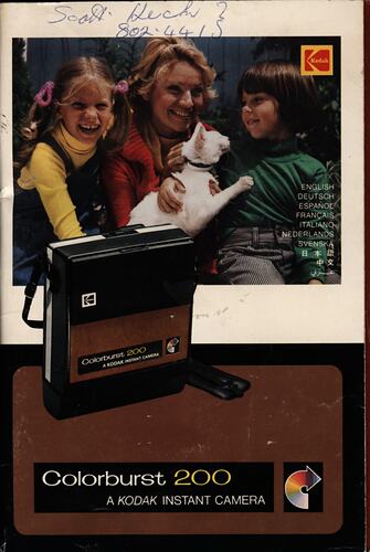 Cover page with photograph of family and cat.