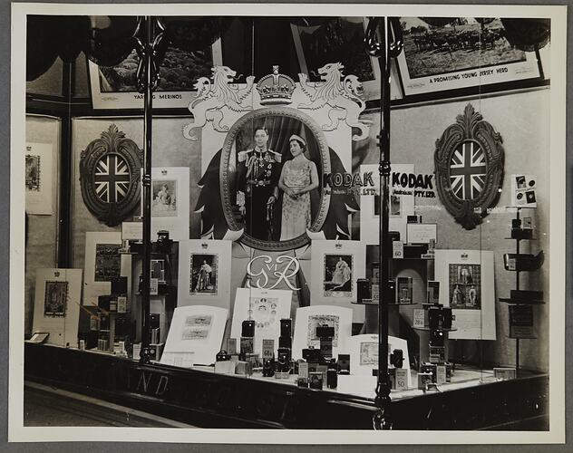 Shopfront display of George VI commemorative prints.