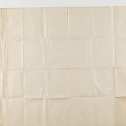 Off-white cloth-backed paper map.