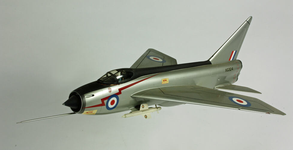 Silver model aeroplane. Blue, white and red rondels on wings and fuselage.