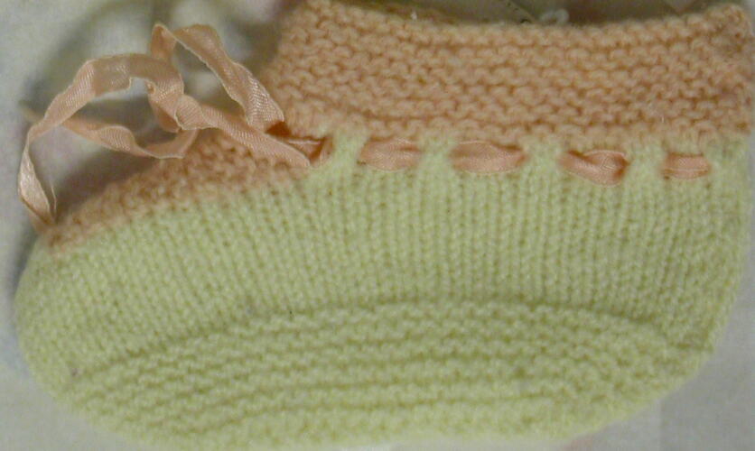 Knitted cream and pink baby  bootie.
