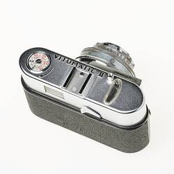 All metal silver and black body 35mm camera. Top view.