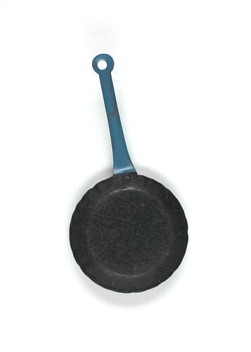 Round toy frying pan with blue handle.