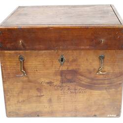 Rectangular wooden box with two latches.