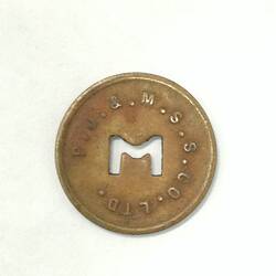 Round coin with M cut out of centre.