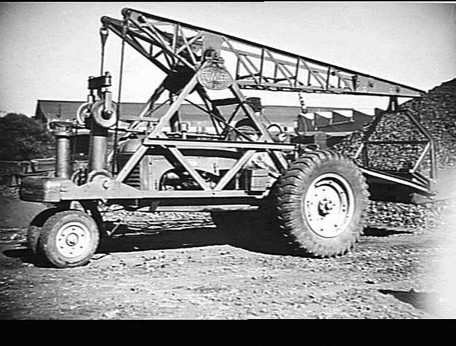 MOBILE CRANE FITTED WITH SCOOP SHOVEL LOADING COKE FROM DUMP TO TRUCK: MAY 1946