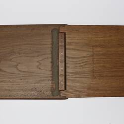 Back view of open rectangular wooden album showing front and back covers.