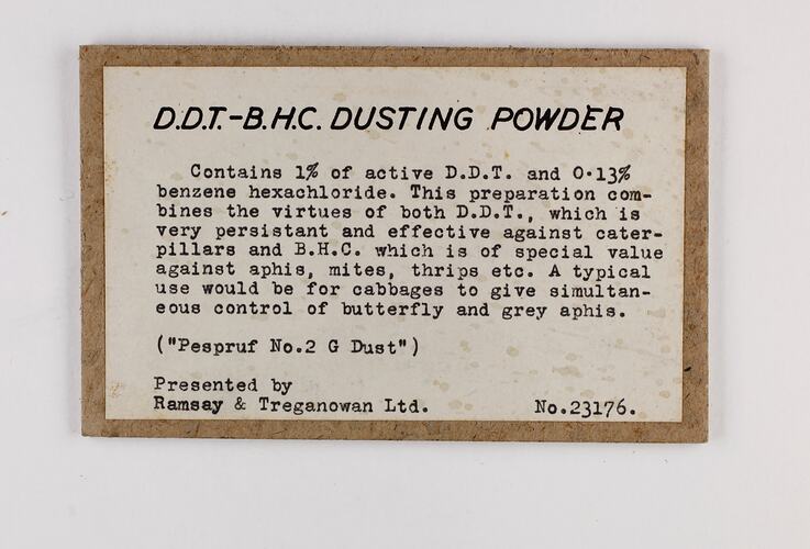 White rectangular label with black text with brown border.