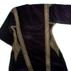 A purple velvet coat with lace detailing.