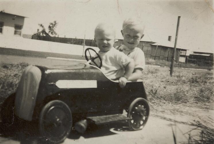 Digital Photograph - Two Boys in Toy Car in Front Yard, Altona, 1952