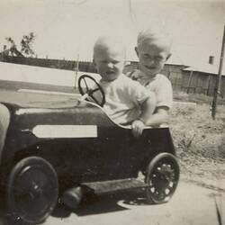 Digital Photograph - Two Boys in Toy Car in Front Yard, Altona, 1952