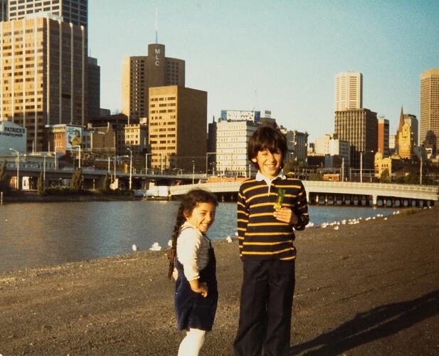 Digital Photograph - Boy & Girl on Southbank, with City behind them, Melbourne, 1981