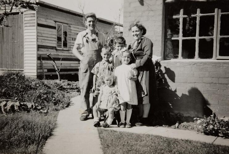 Digital Photograph - Newly Arrived Migrant Family Standing Near Temporary Accommodation, Ringwood East, 1955
