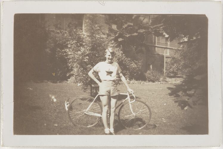 Harry Clarke with his bicycle in the garden area of the Kodak Australasia Pty Ltd factory site in Abbotsford, in the early 1940s.