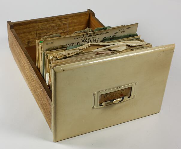 File box containing cards, side view.