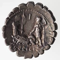 Round coin, aged, two figures facing each other, each holding a spear, and pointing at a pig.