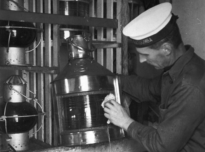[Polishing the oil lamp, 1934.]